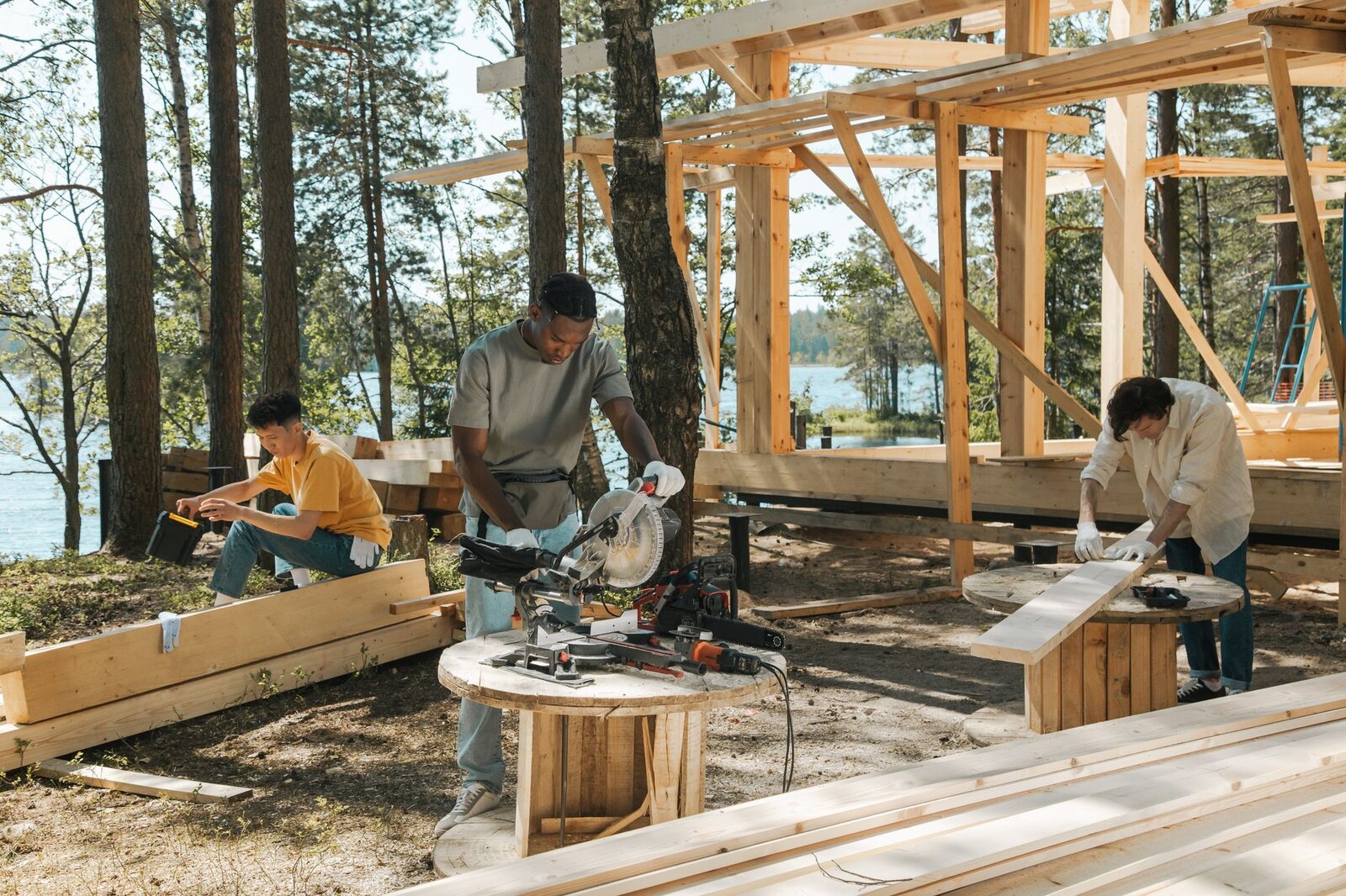 Carpentry crew framing a wood-frame home together on site