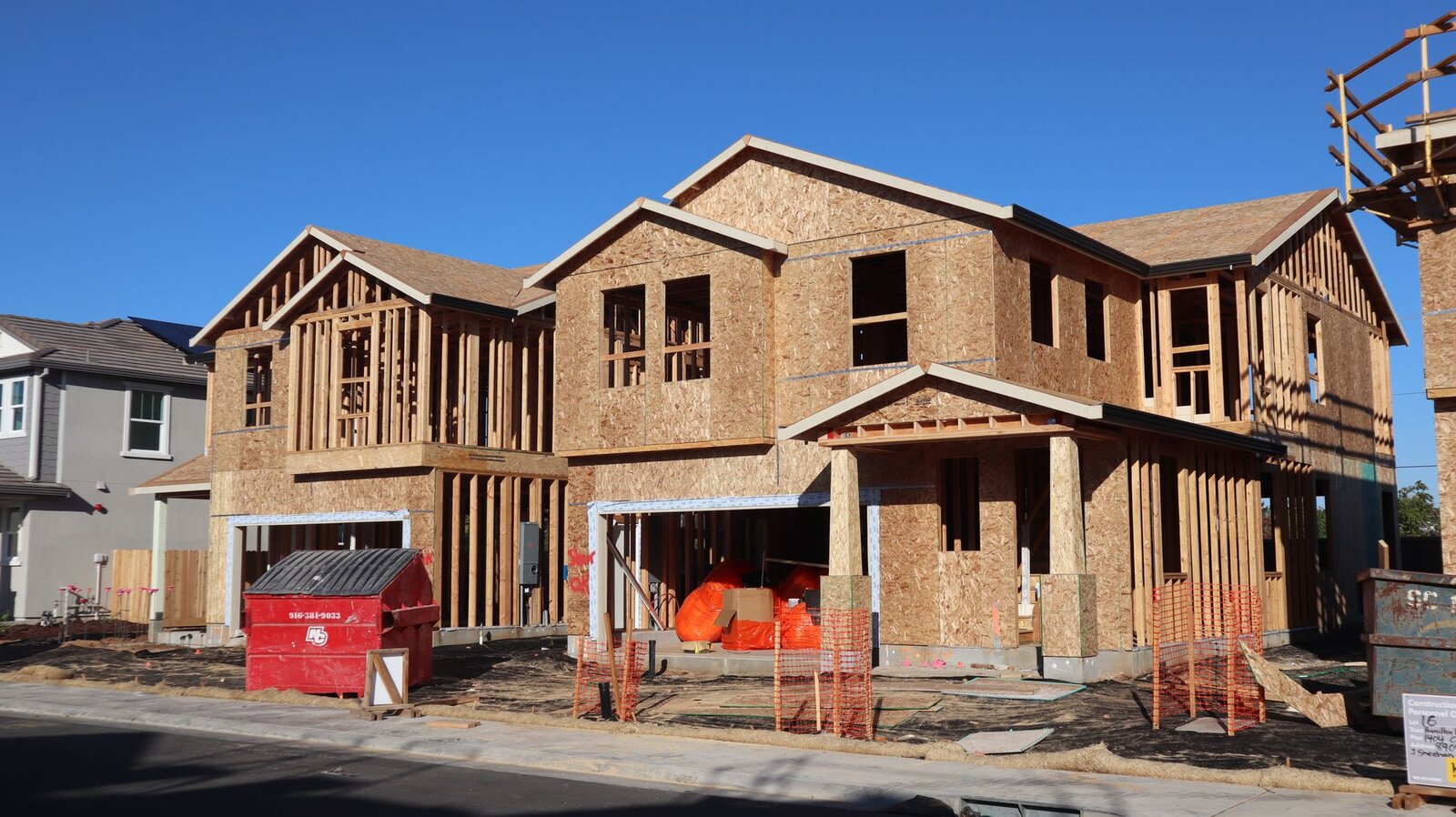 Wood framing and sheathing exposed on a New England home during structural repair