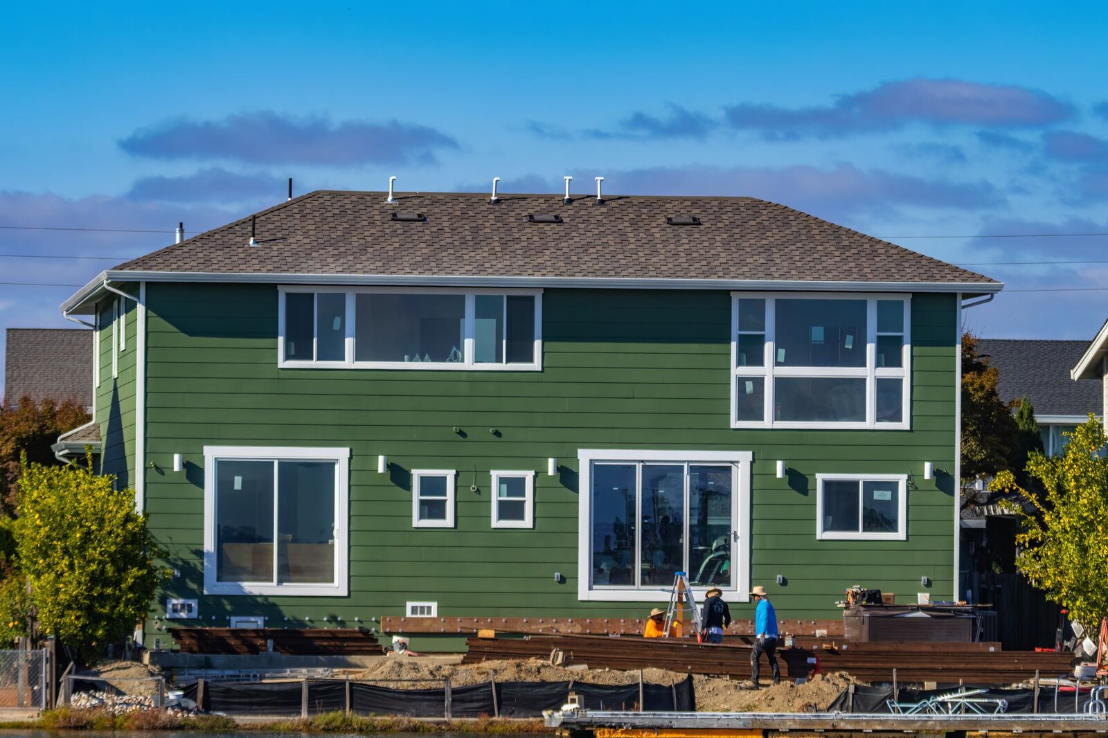 New England home clad in fresh horizontal lap siding with white trim
